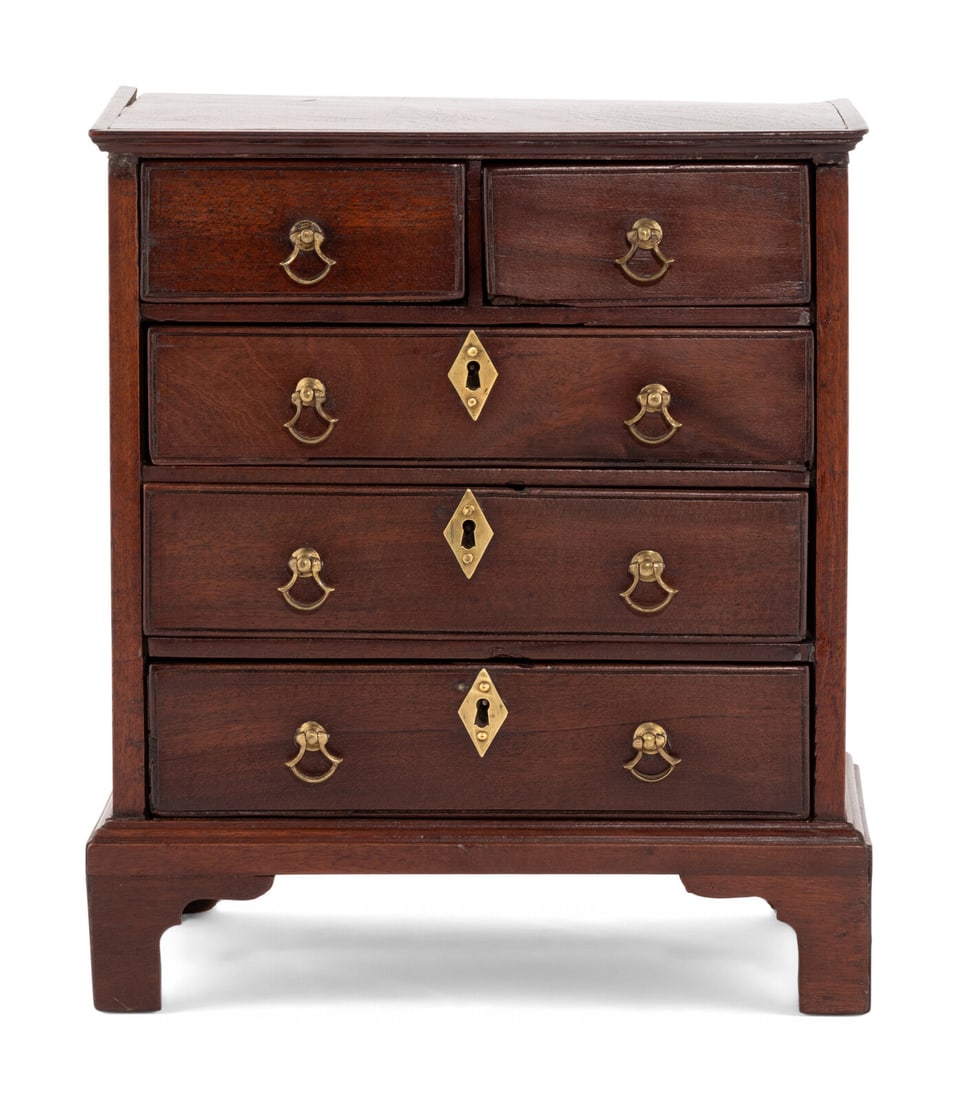 A George III Mahogany Diminutive Chest of Drawers: A George III Mahogany Diminutive Chest of Drawers Mid-18th Century Height 11 x width 9 1/2 x depth 6 1/2 inches. Property from the Charlecote Antique Store, Kansas City, Missouri This lot is located i