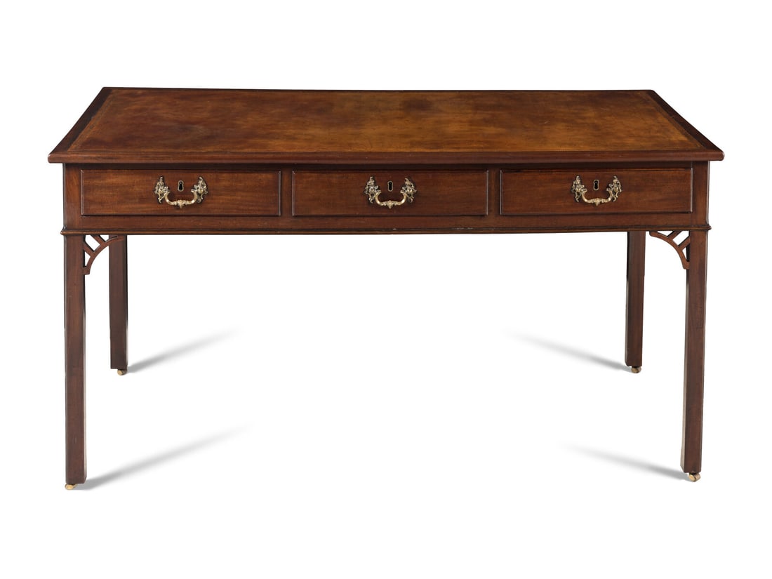 A George III Mahogany Writing Desk: A George III Mahogany Writing Desk Late 18th Century Height 32 1/2 x width 62 x depth 31 inches. This lot is located in Chicago.