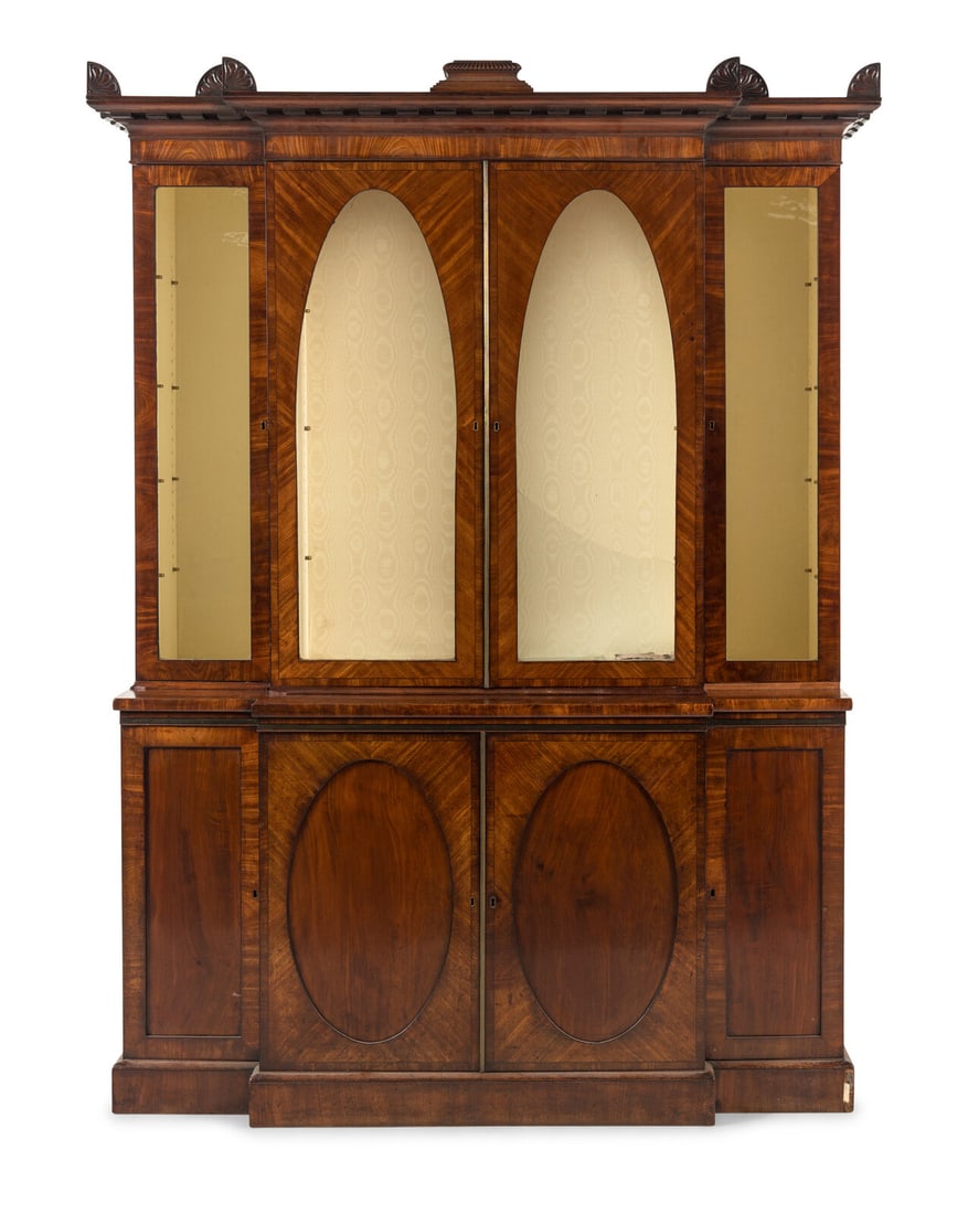 A Regency Mahogany Breakfront Bookcase: A Regency Mahogany Breakfront Bookcase Manner of George Smith, Early 19th Century Height 94 x width 66 1/2 x depth 22 inches. This lot is located in Chicago.