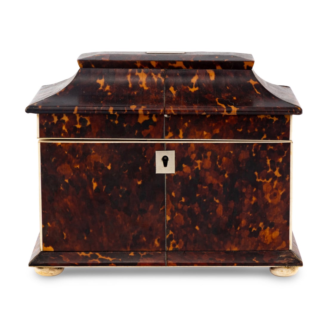 A Regency Tortoise Shell Tea Caddy: A Regency Tortoise Shell Tea Caddy 19th Century Height 6 1/2 x width 7 3/4 x depth 4 1/2 inches. This lot is located in Chicago.