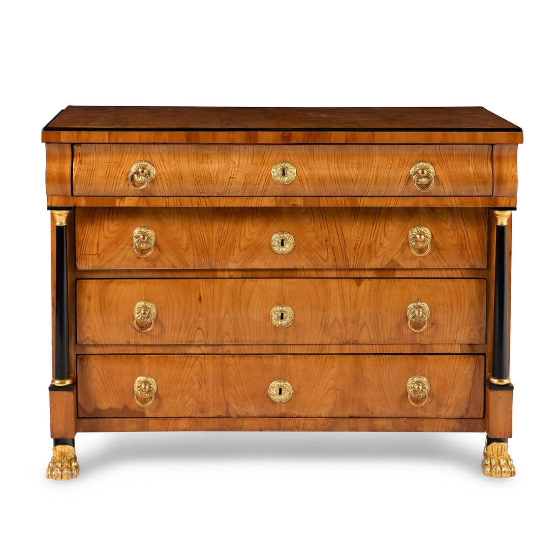 An Austrian Neoclassical Parcel Gilt and Ebonized Ash Commode: An Austrian Neoclassical Parcel Gilt and Ebonized Ash Commode Circa 1830-40 Height 36 x width 48 x depth 22 3/4 inches. Property from the Estate of Beverly Flynn, Chicago, Illinois This lot is