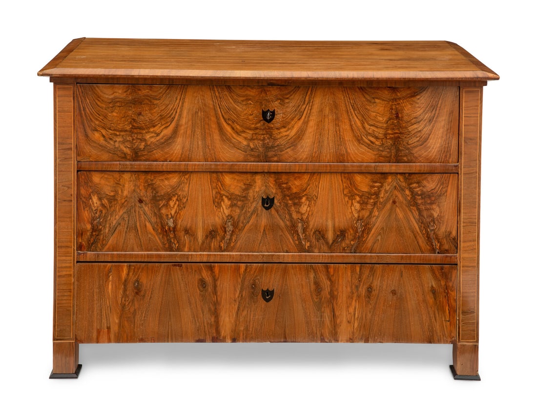 A Biedermeier Walnut Commode: A Biedermeier Walnut Commode 19th Century Height 35 3/4 x width 51 1/2 x depth 25 inches. This lot is located in Chicago.