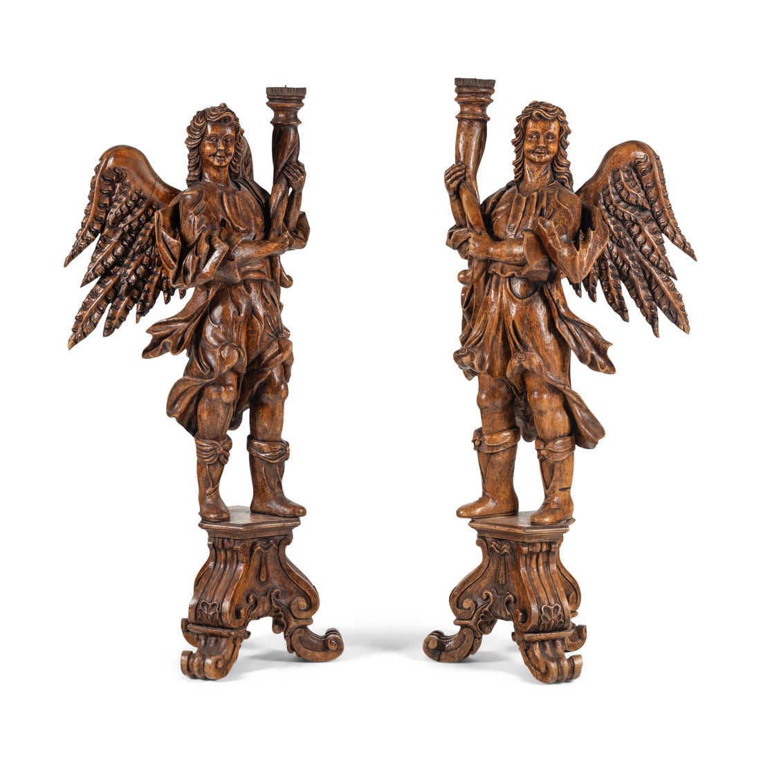 A Pair of Monumental Carved Walnut Figural TorchËres: A Pair of Monumental Carved Walnut Figural TorchËres 20th Century one figure's wings with prior repair, the wings now detached. Height 72 1/4 x width 24 x depth 28 inches. Property from the