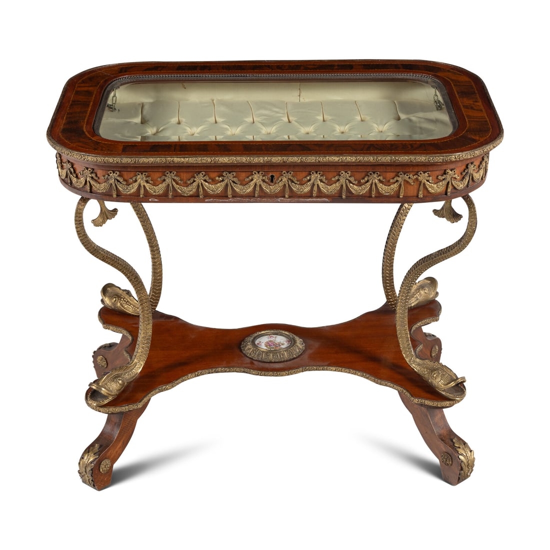 A Neoclassical Style Gilt Metal Mounted Mahogany Vitrine Table: A Neoclassical Style Gilt Metal Mounted Mahogany Vitrine Table 20th Century Height 28 1/2 x width 33 x depth 21 1/4 inches. Property of a California Collector This lot is located in Chicago.