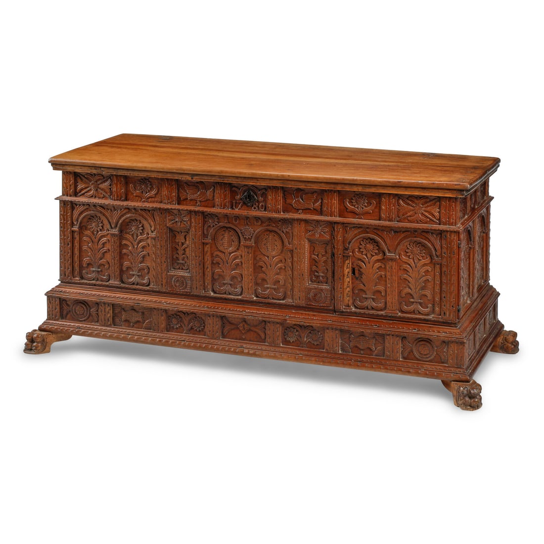 A Continental Carved Walnut Cassone: A Continental Carved Walnut Cassone 18th Century and Later the interior cedar lined; the proper left side with a cabinet door opening to three drawers. Height 25 1/2 x width 59 x depth 24 inches.
