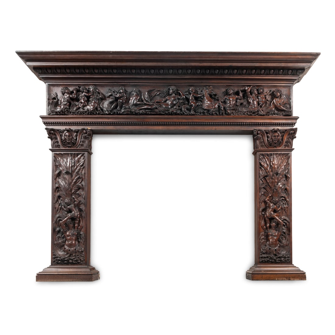 An Italian Carved Walnut Mantelpiece: An Italian Carved Walnut Mantelpiece 18th/19th Century and Adapted Height 66 1/2 x width 82 1/2 x depth 8 1/4 inches. This lot is located in Chicago.
