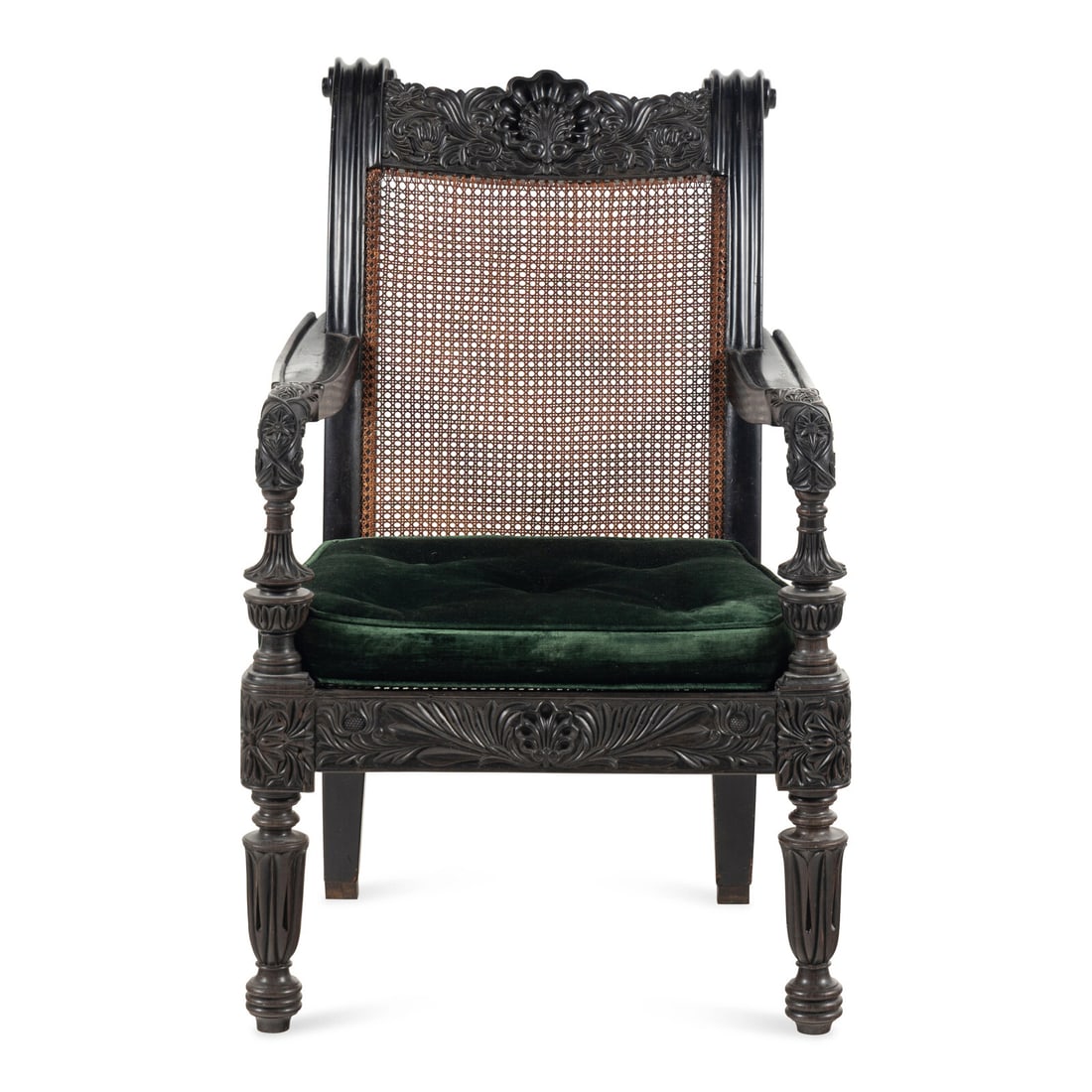An Anglo-Colonial Carved Ebony and Caned Armchair (1 of 3)
