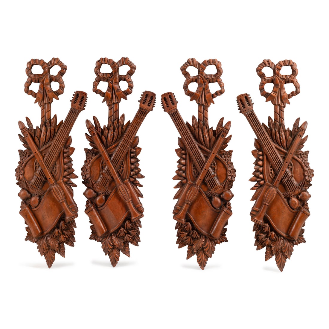 A Set of Four Italian Renaissance Style Carved Wood Wall Trophies: A Set of Four Italian Renaissance Style Carved Wood Wall Trophies 20th Century Height 42 x width 13 inches. This lot is located in Chicago.