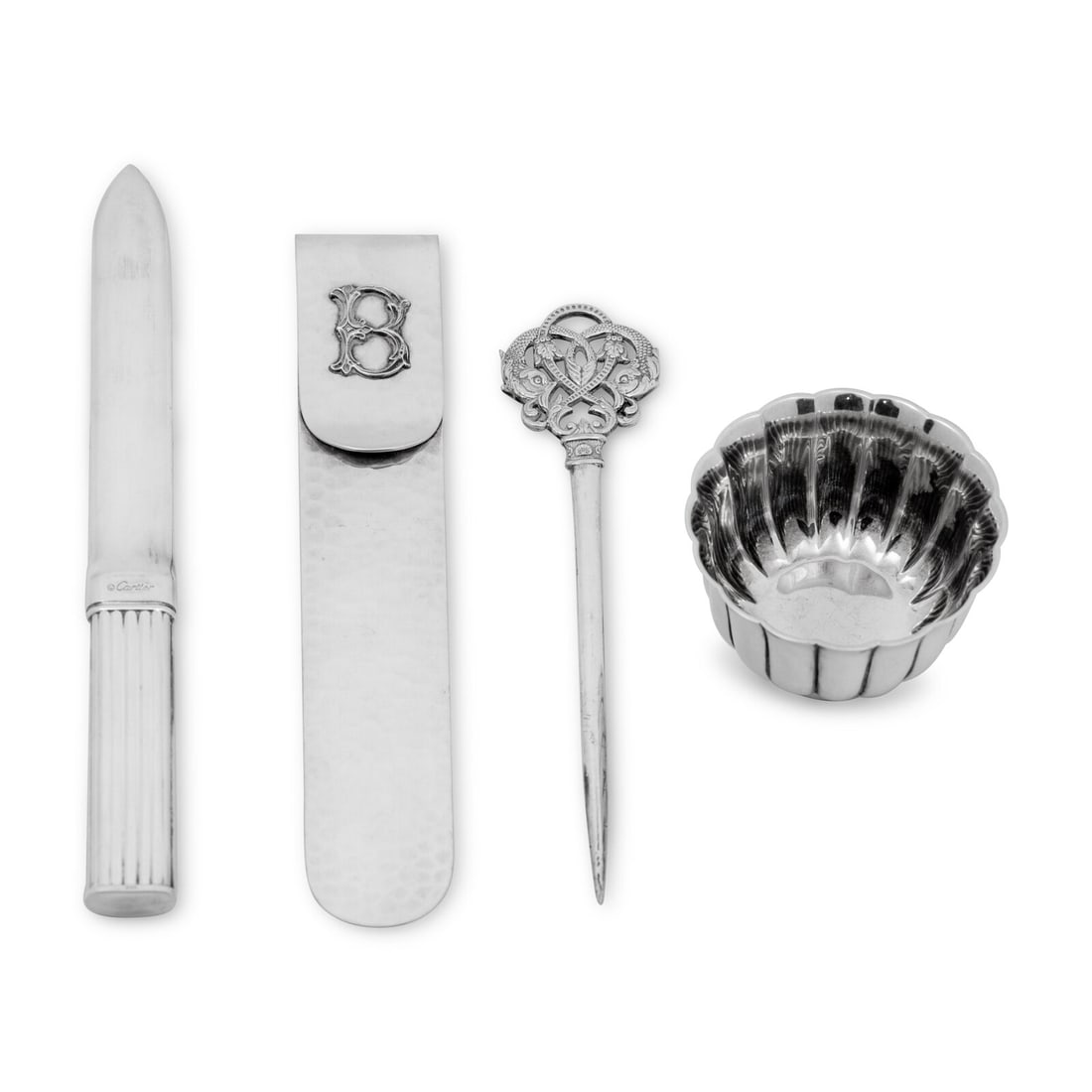 A Federico Buccellati Sterling Silver Bookmark and Associated Silver Items: A Federico Buccellati Sterling Silver Bookmark and Associated Silver Items Together with a Bulgari silver small bowl, a Cartier silver plated letter opener, and an english silver plated letter opener.