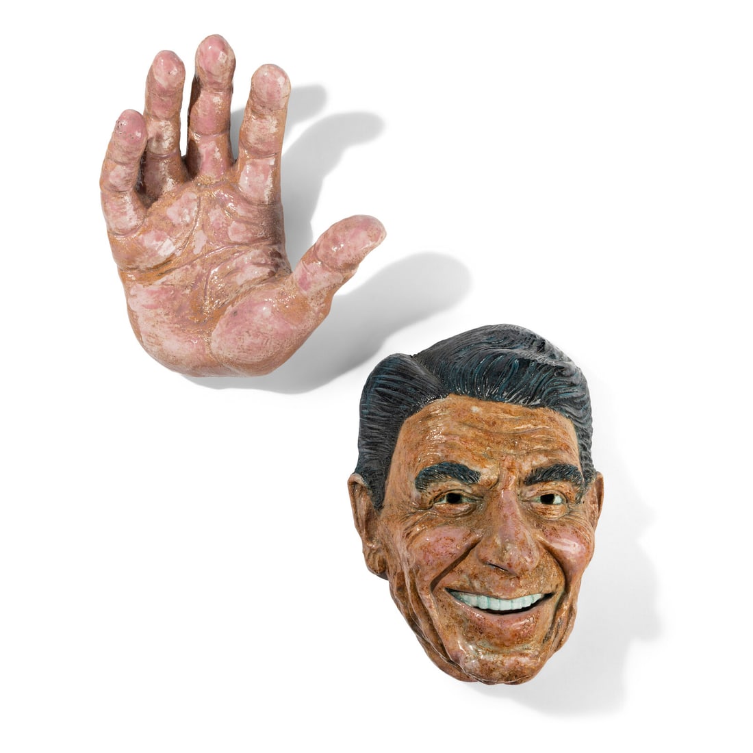 Robert Arneson (American, 1930-1992) Hi Handed, 1986: Robert Arneson (American, 1930-1992) Hi Handed, 1986 glazed ceramic signed Arneson and dated (verso of mask); inscribed (verso of hand) Head: 18 x 12 1/2 x 8 inches; Hand: 16 x 13 x 6 1/2 inches. Prop