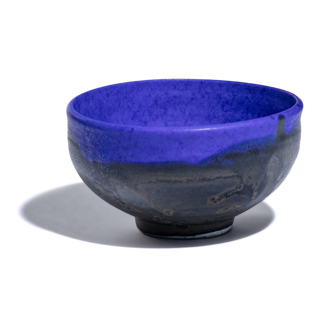 Toshiko Takaezu (American, 1922Ò2011) Bowl: Toshiko Takaezu (American, 1922Ò2011) Bowl Glass Blue-glazed porcelain etched with artist cipher 'TT' to underside 2 3/4 h x 5 dia inches. This lot is located in Chicago.