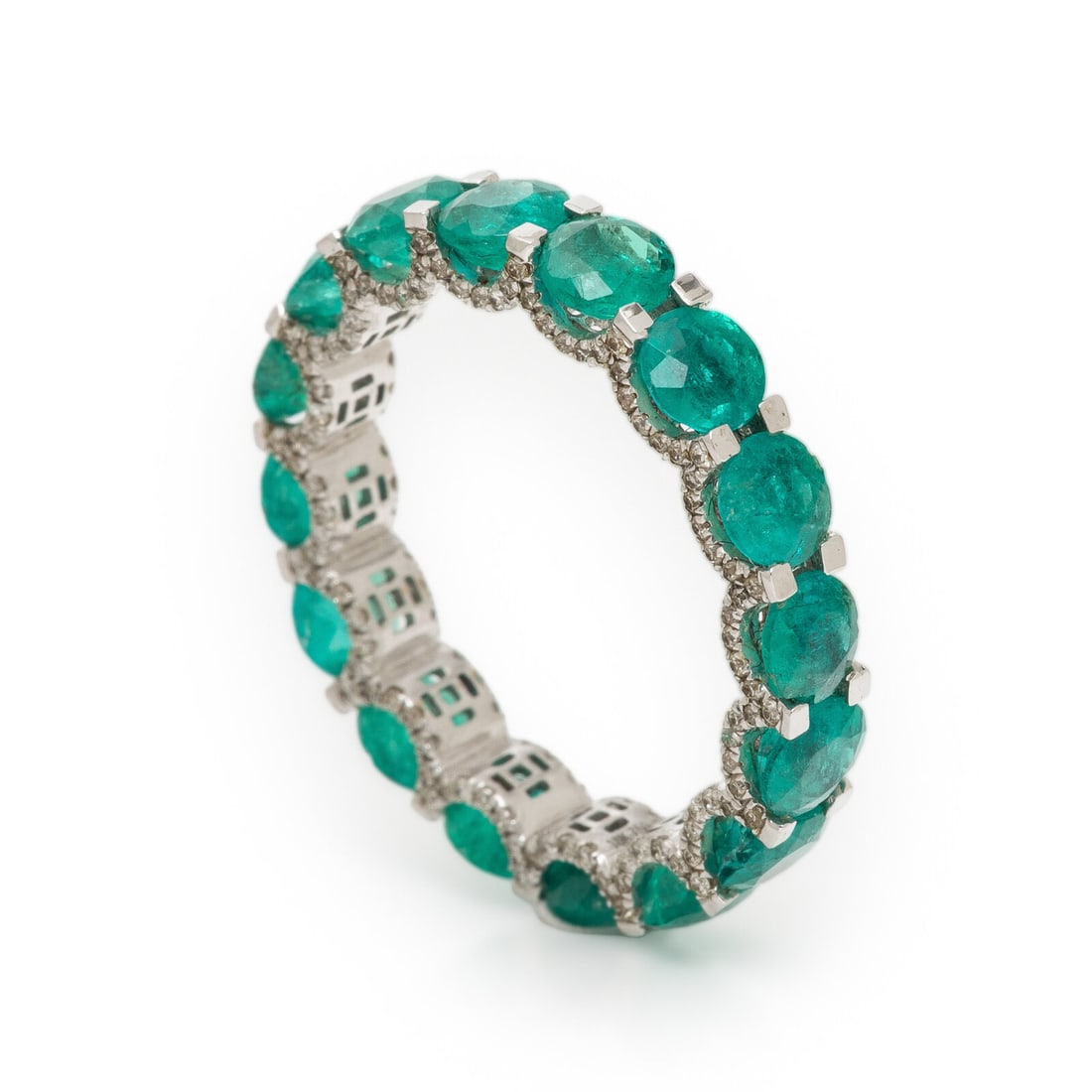 Emerald, Diamond, and White Gold Ring: Emerald, Diamond, and White Gold Ring Round emeralds and single cut diamonds weighing approximately 0.35 carat total. White gold. Ring size 6 1/2. Gross weight: 1.70 dwt. Property from a Naples, Flori