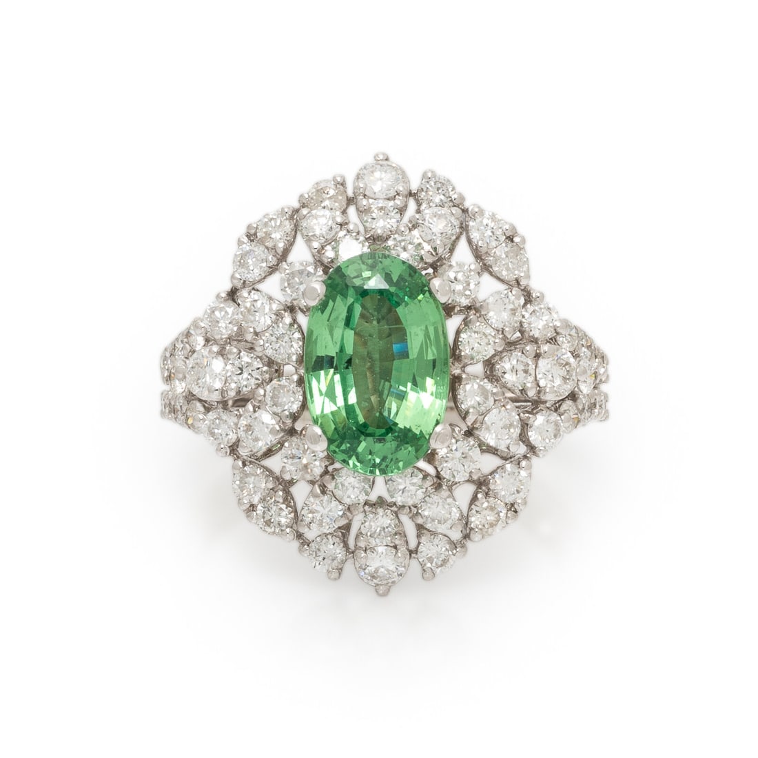 Tsavorite Garnet, Diamond, and White Gold Ring: Tsavorite Garnet, Diamond, and White Gold Ring Oval tsavorite garnet measuring approximately 10.28 x 6.62 mm, and round brilliant cut diamonds weighing approximately 1.25 carats total. 18 karat white 