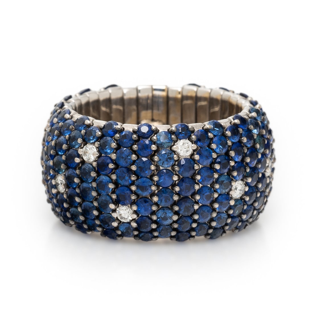 Zydo, Sapphire, Diamond, White Gold Flexible Ring: Zydo, Sapphire, Diamond, White Gold Flexible Ring Round brilliant cut diamonds weighing approximately 0.35 carat total, and round sapphires. White gold. Ring size 7 1/4 - 10. Stamp: ZYDO. Gross weight