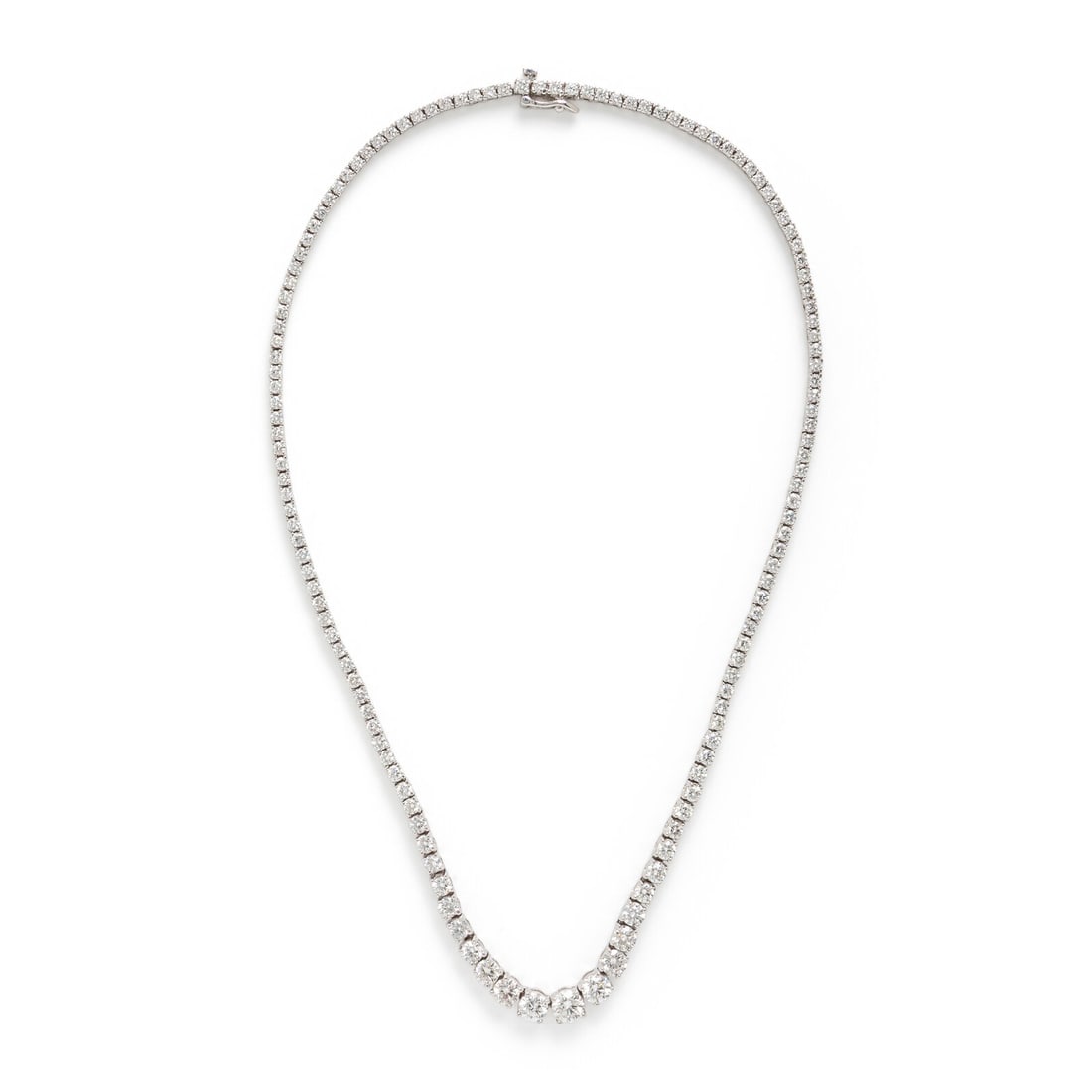 Diamond and White Gold Rivière Necklace: Diamond and White Gold Rivière Necklace Graduated round brilliant cut diamonds weighing approximately 10.00 carats total. 14 karat white gold. 16 inches long. Stamp: 14K. Gross weight: 15.80 dwt. Thi