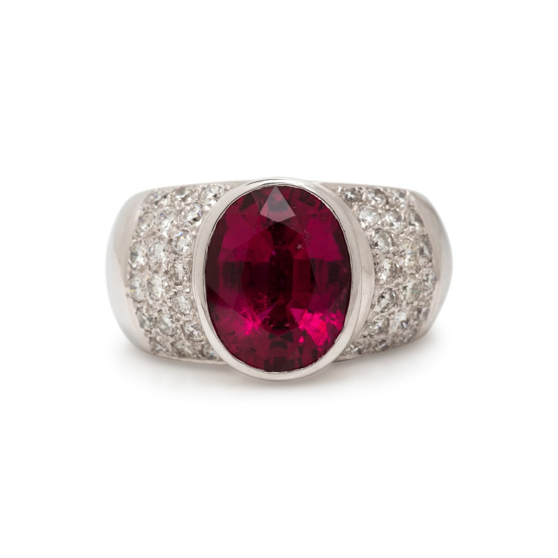 Rubellite Tourmaline and Diamond Ring: Rubellite Tourmaline and Diamond Ring Oval rubellite tourmaline measuring approximately 12.05 x 9.50 mm, and round brilliant cut diamonds weighing approximately 0.75 carat total. 18 karat white gold. 