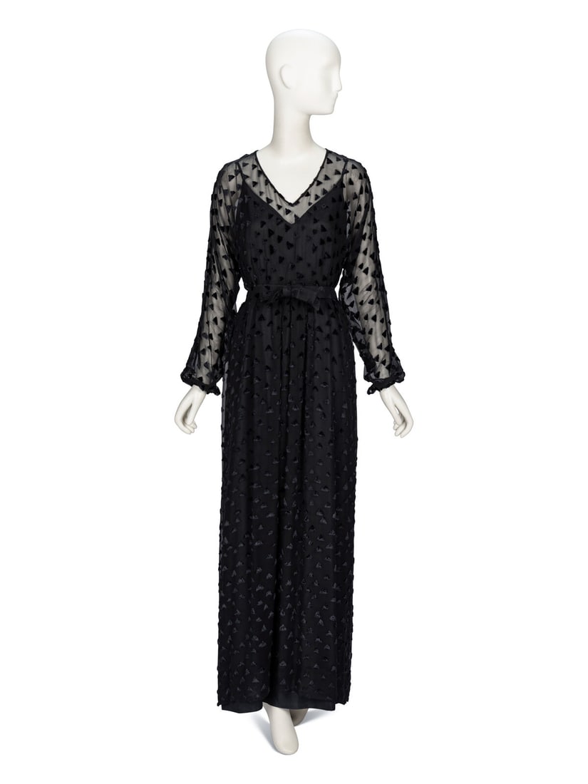 La Mendola, Black Cut Velvet Dress: La Mendola, Black Cut Velvet Dress Evening dress in black silk cut velvet on a chiffon base. Collarless deep V neckline. Full-length dolman sleeves with button closures at sleeve hems. Light gathers a