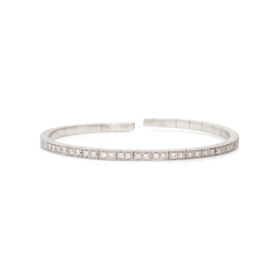 Diamond and White Gold Flexible Cuff Bracelet: Diamond and White Gold Flexible Cuff Bracelet Round brilliant cut diamonds weighing approximately 0.55 carat total. 18 karat white gold. 6 inches inner circumference. Stamp: (maker's mark) 750 (Italia
