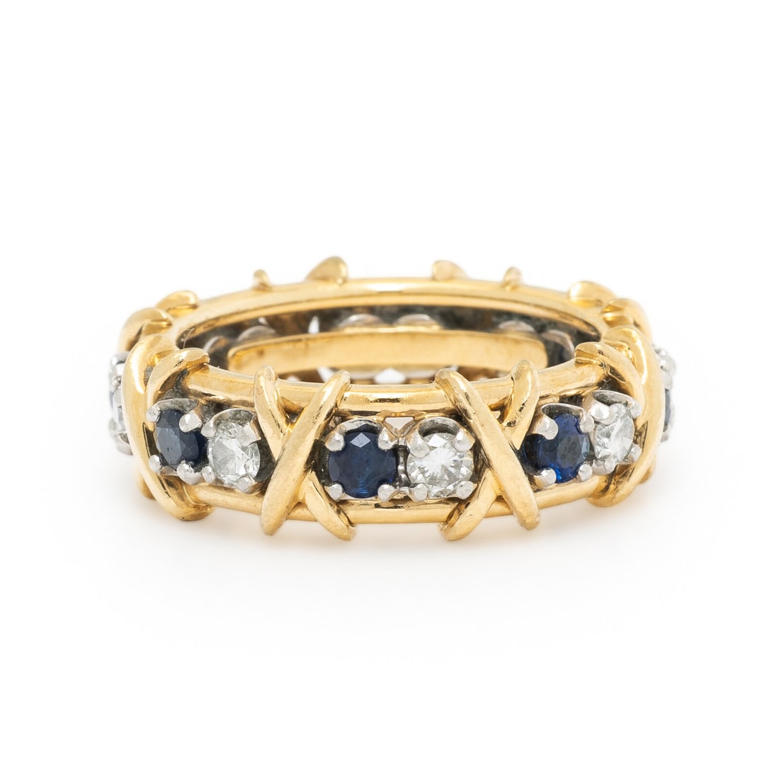 TIFFANY & CO., SCHLUMBERGER, SAPPHIRE AND DIAMOND 'SIXTEEN STONE' RING: TIFFANY & CO., SCHLUMBERGER, SAPPHIRE AND DIAMOND 'SIXTEEN STONE' RING Designed with 'X' motifs, set with round diamonds weighing approximately 0.55 carat total and round sapphires. Mounted in 18 kara