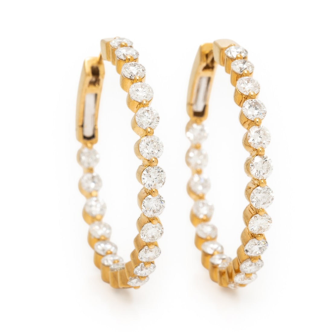 Diamond and Yellow Gold Inside Out Hoop Earrings: Diamond and Yellow Gold Inside Out Hoop Earrings Round brilliant cut diamonds weighing approximately 4.12 carats total. 18 karat yellow gold. 1 1/4 inches long. Stamp: 18K 750 (maker's mark) D 4.12. G