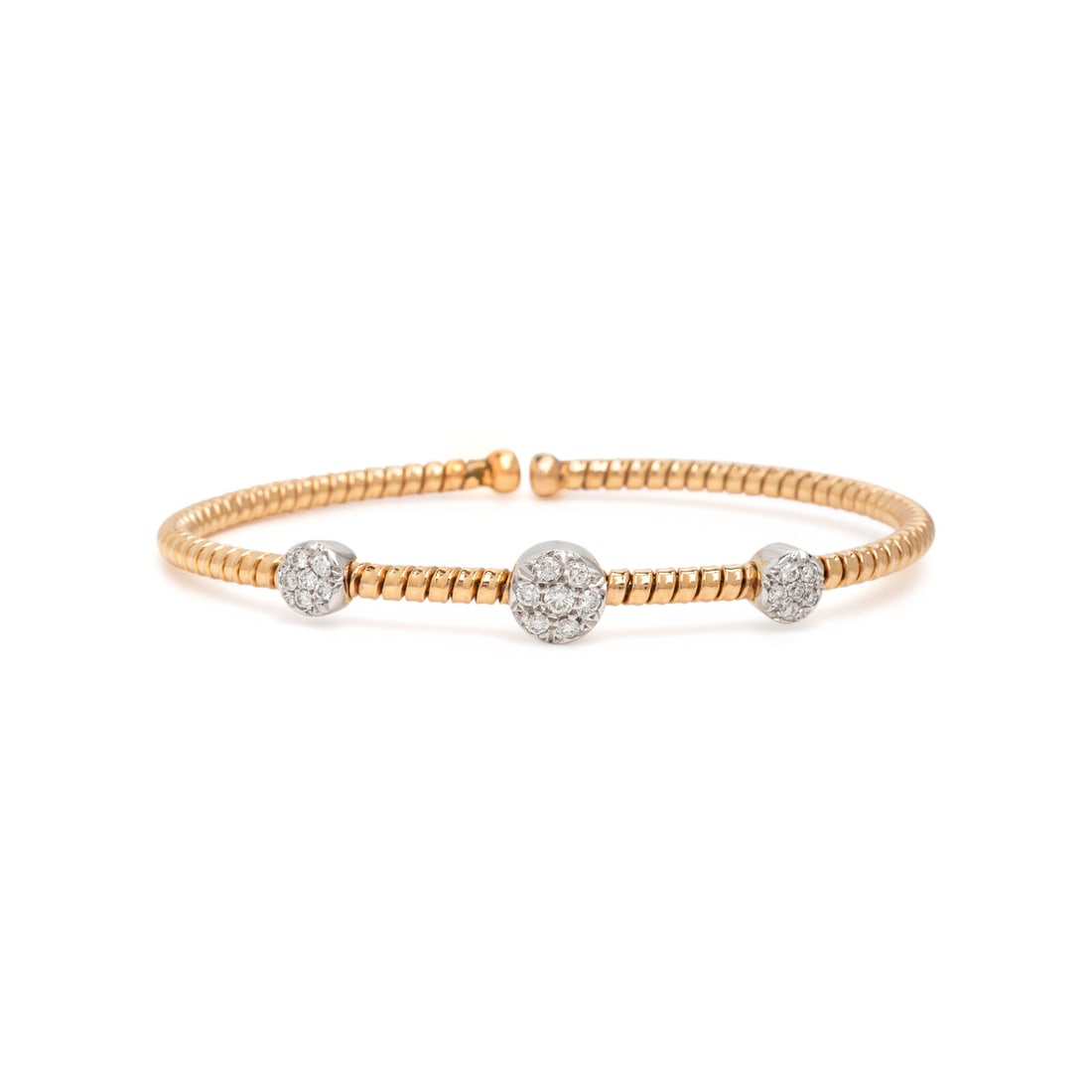 Bicolor Gold and Diamond Flexible Cuff Bracelet: Bicolor Gold and Diamond Flexible Cuff Bracelet Round brilliant cut diamonds weighing approximately 0.15 carat total. 18 karat yellow and white gold. 6 1/4 inches inner circumference. Stamp: DAG 18KT.
