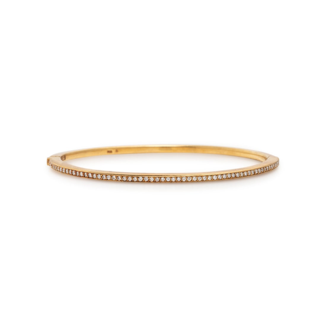 Diamond and Yellow Gold Bangle Bracelet: Diamond and Yellow Gold Bangle Bracelet Round brilliant and a princess cut diamonds weighing approximately 0.55 carat total, hinged with side clasp. 18 karat yellow gold. 6 3/4 inches inner circumfere