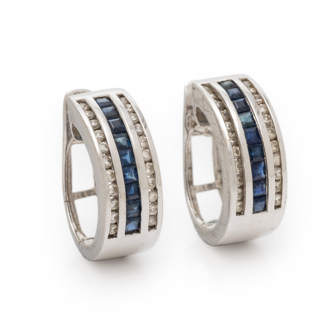 Sapphire, Diamond, and White Gold Earrings: Sapphire, Diamond, and White Gold Earrings Channel-set round brilliant cut diamonds weighing approximately 0.45 carat total, and square step cut sapphires. 14 karat white gold. 9/16 inch long. Stamp: 