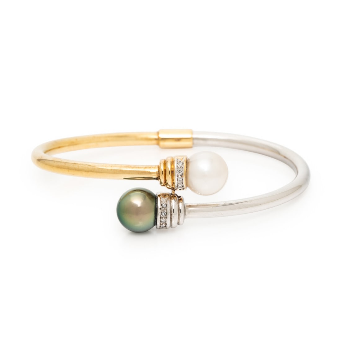 Cultured Pearl, Diamond, and Bicolor Gold Flexible Cuff Bracelet: Cultured Pearl, Diamond, and Bicolor Gold Flexible Cuff Bracelet Cultured white and gray pearls measuring approximately 10.90 mm (origin of color not tested), and round brilliant cut diamonds, hinged 