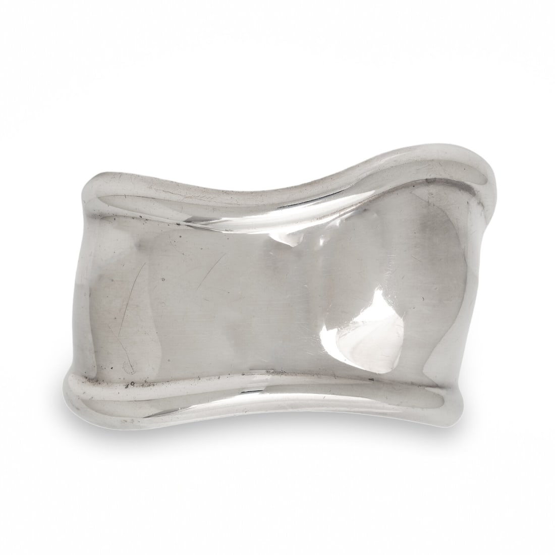 Tiffany & Co., Elsa Peretti, 'Bone Cuff', Sterling Silver Bracelet: Tiffany & Co., Elsa Peretti, 'Bone Cuff', Sterling Silver Bracelet Sterling silver. 6 inches inner circumference, 43 mm wide. Stamp: TIFFANY & CO. (Elsa Peretti maker's mark) 925 ITALY. Gross weight: 