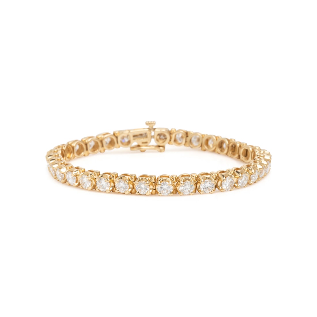 Diamond and Yellow Gold Line Bracelet: Diamond and Yellow Gold Line Bracelet Round brilliant cut diamonds weighing approximately 6.80 carats total. 14 karat yellow gold. 6 7/8 inches long. Stamp: 14K (maker's mark). Gross weight: 12.15 dwt