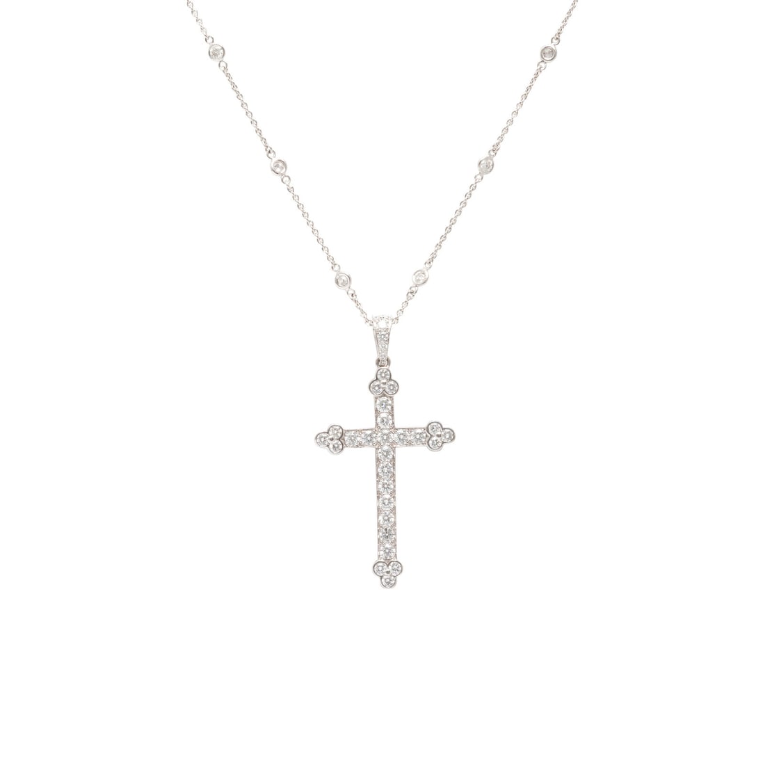Cartier, Diamond and White Gold Cross Pendant with a Roberto Coin Diamond Station Chain Necklace: Cartier, Diamond and White Gold Cross Pendant with a Roberto Coin Diamond Station Chain Necklace The pendant set with round brilliant cut diamonds weighing approximately 2.50 carats total, suspended f
