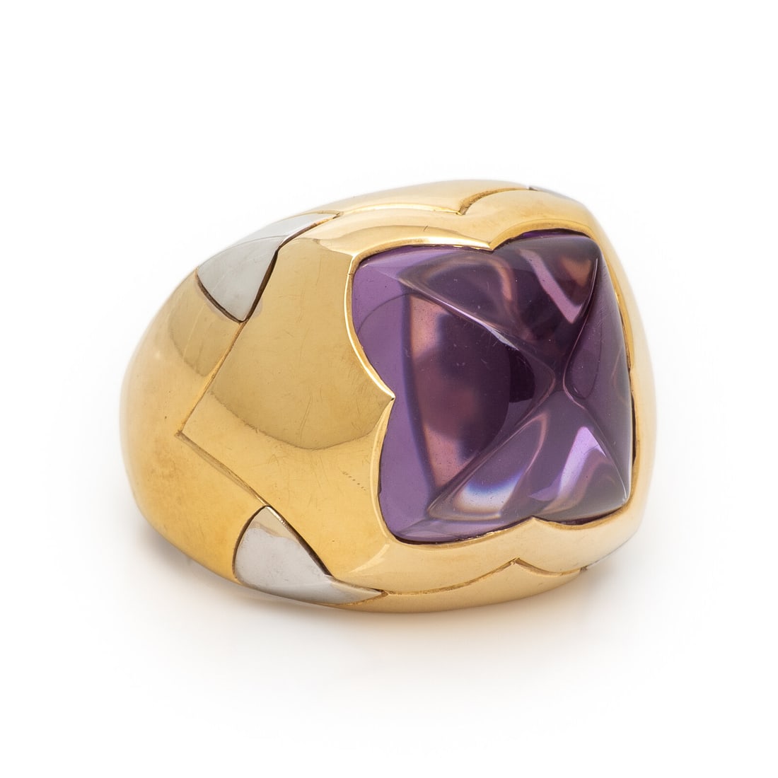 Bulgari, 'Pyramid', Amethyst and Bicolor Gold Ring: Bulgari, 'Pyramid', Amethyst and Bicolor Gold Ring Pyramid shape cabochon amethyst measuring approximately 12.50 x 12.50 x 7.70 mm. Yellow and white gold. Ring size 5 1/2. Stamp: (partially obscured) 
