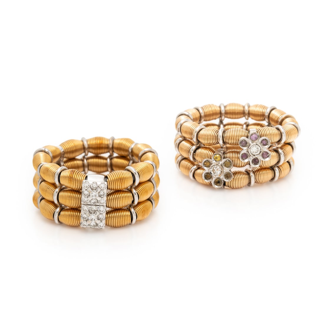 Two Flexible Multigem and Gold Rings: Two Flexible Multigem and Gold Rings Including one ring with round brilliant cut diamonds weighing approximately 0.25 carat total, and one ring with pink and yellow sapphires and round brilliant cut d