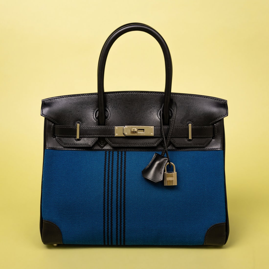 Hermès, Potamus Birkin 28 in Blue Toile & Noir Box Leather: Hermès, Potamus Birkin 28 in Blue Toile & Noir Box Leather Potamus Birkin 28 bag in black-striped blue Toile canvas and Noir Box leather with palladium-plated hardware. Label: Hermès Stamp: J in Squ