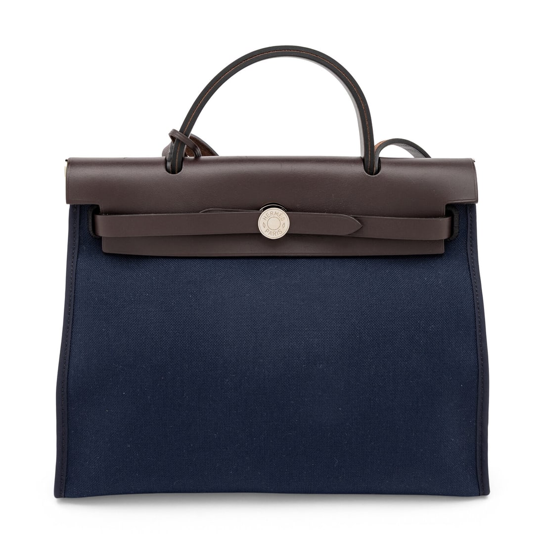 Hermès, Herbag Zip 31 Bag in Leather & Toile: Hermès, Herbag Zip 31 Bag in Leather & Toile Herbag Zip 31 bag in deep brown Vache Hunter leather and Bleu Marine Toile canvas with palladium-plated hardware. Threaded strap closure, flat leather han