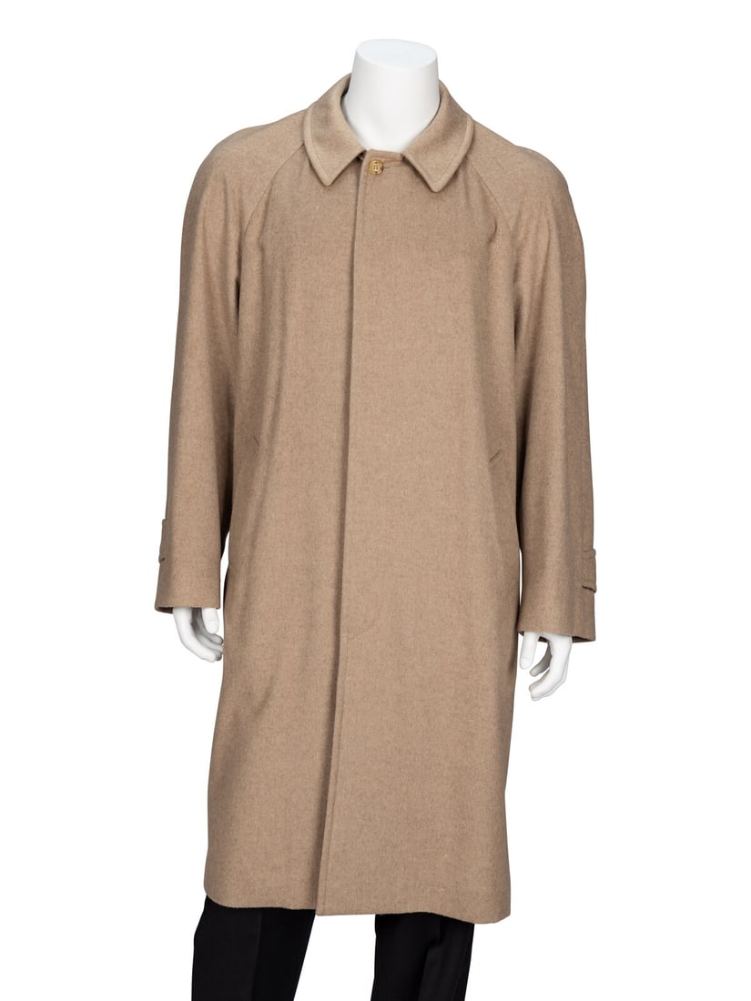 Agnona, Taupe Cashmere Coat: Agnona, Taupe Cashmere Coat Knee-length coat in taupe heathered cashmere-blend coating. Spread collar. Full-length raglan sleeves with buttoned tabs near sleeve hems. Two welt pockets at front; one in