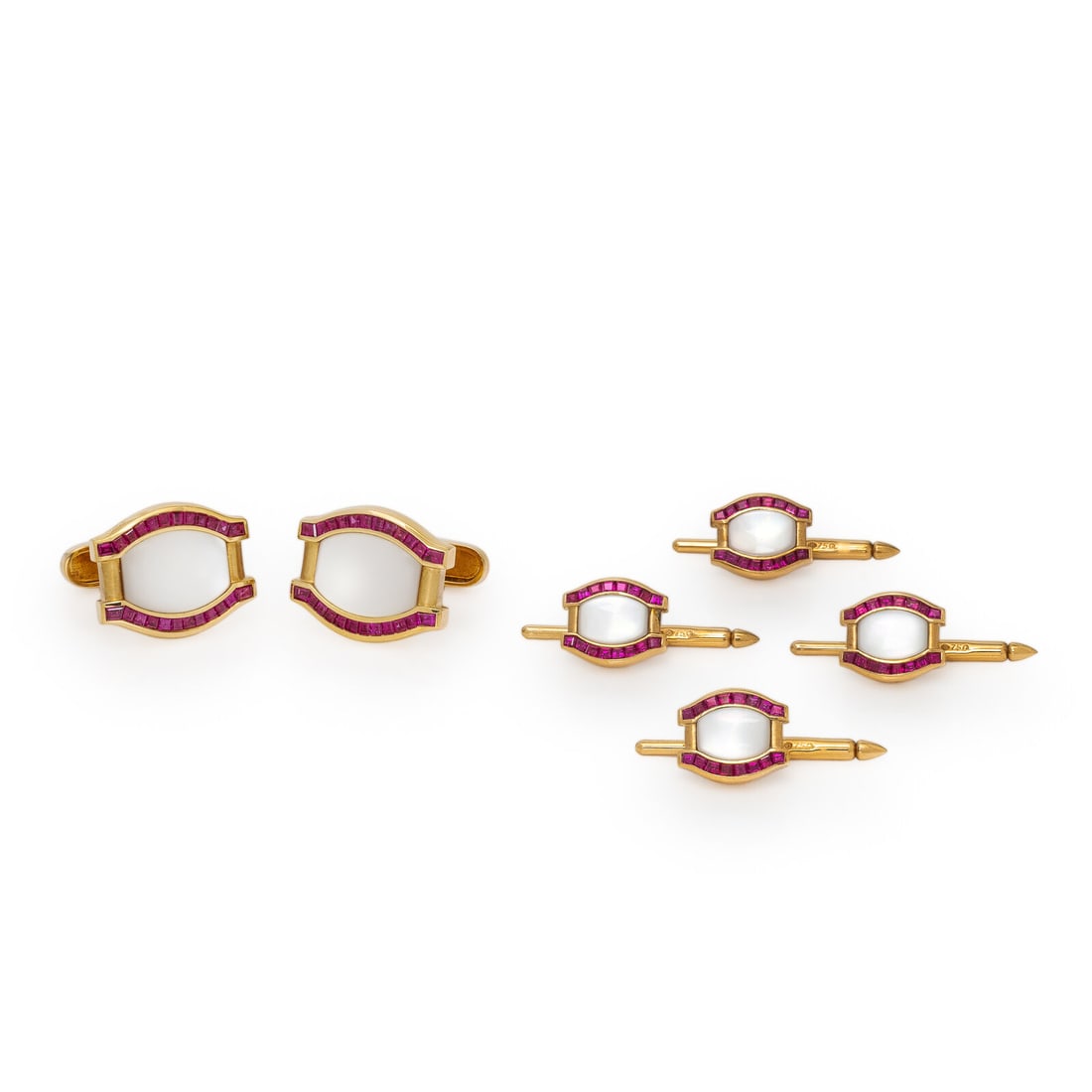 Asprey & Garrard, Yellow Gold, Ruby, and Mother-of-Pearl Dress Set: Asprey & Garrard, Yellow Gold, Ruby, and Mother-of-Pearl Dress Set Set with mother-of-pearl plaques and calibrÈ-cut rubies. 18 karat yellow gold. Mounted in 18 karat yellow gold. Cufflinks: 3/4 x