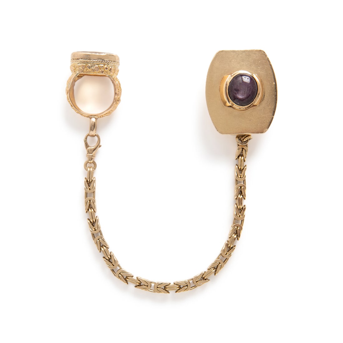 Yellow Gold and Multigem Gentleman's Accessory: Yellow Gold and Multigem Gentleman's Accessory Oval citrine weighing approximately 25.00 carats by formula and round cabochon star purple sapphire weighing approximately 24.00 carats by formula. Yello