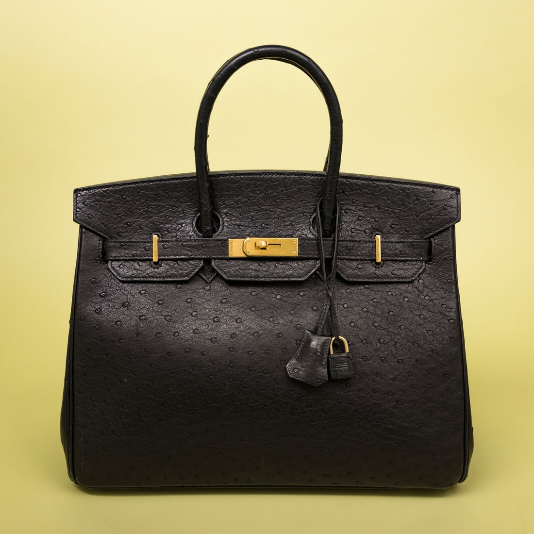 Hermès, Birkin 35 in Black Ostrich: Hermès, Birkin 35 in Black Ostrich Birkin 35 bag in Black Ostrich leather with gold-plated hardware. Label: Hermès Stamp: J in Square Date: 2006 Country of Origin: France Approximate Measurements: 1