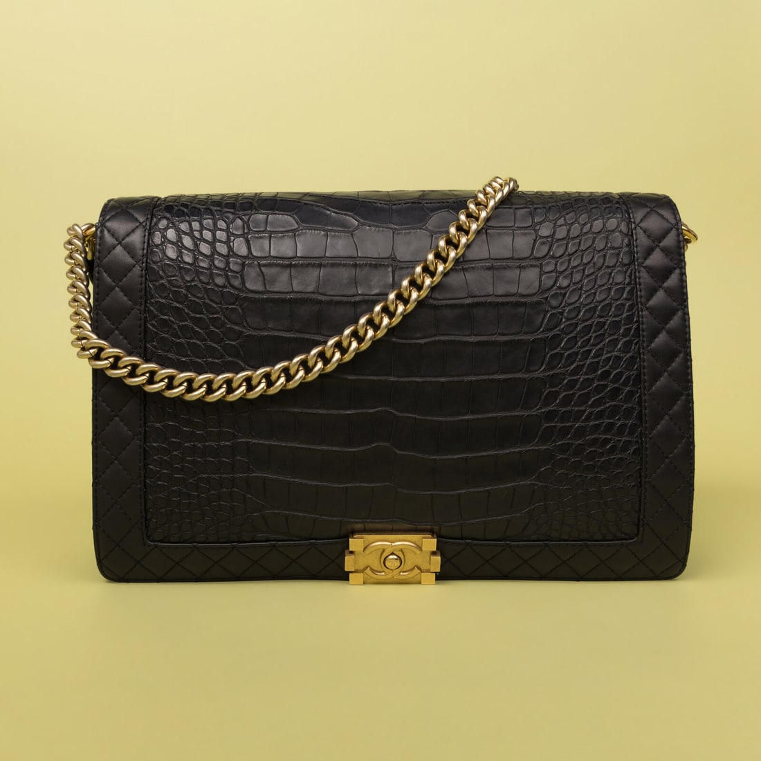 Chanel, XL Boy Bag in Navy Alligator: Chanel, XL Boy Bag in Navy Alligator Extra large Boy Bag in dark navy blue alligator skin with quilted navy leather trim and aged gold-tone hardware. CC push-lock closure and metal chain & alligator s