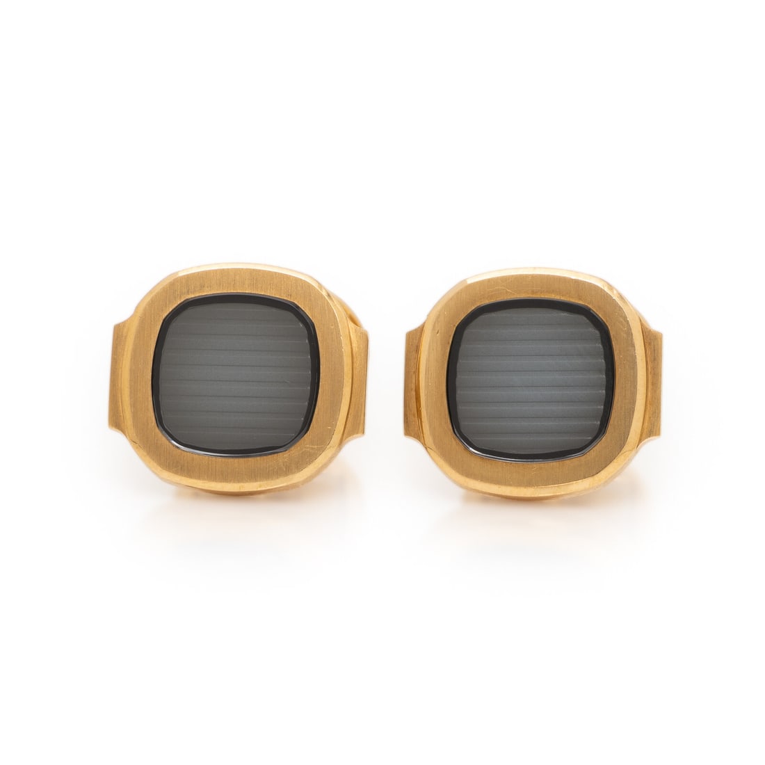 Patek Philippe, 'Nautilus' Cufflinks, Small: Patek Philippe, 'Nautilus' Cufflinks, Small With a blue-gray center. 18 karat yellow gold. 5/8 inch wide. Stamp: PATEK PHILIPPE GENEVE SWISS (Patek Philippe maker's mark) 750 (Swiss hallmarks). Gross 