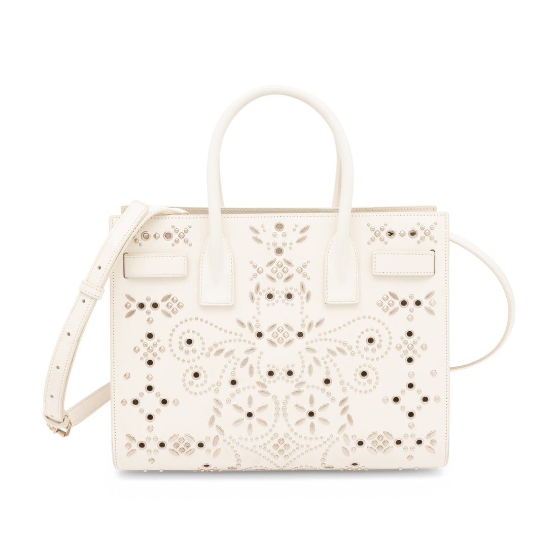 Saint Laurent, Sac du Jour in Bandana-Studded White Leather: Saint Laurent, Sac du Jour in Bandana-Studded White Leather Sac du Jour bag in white leather with Bandana-motif studs and grommets throughout. Open top, rolled leather handles, and removable flat leat