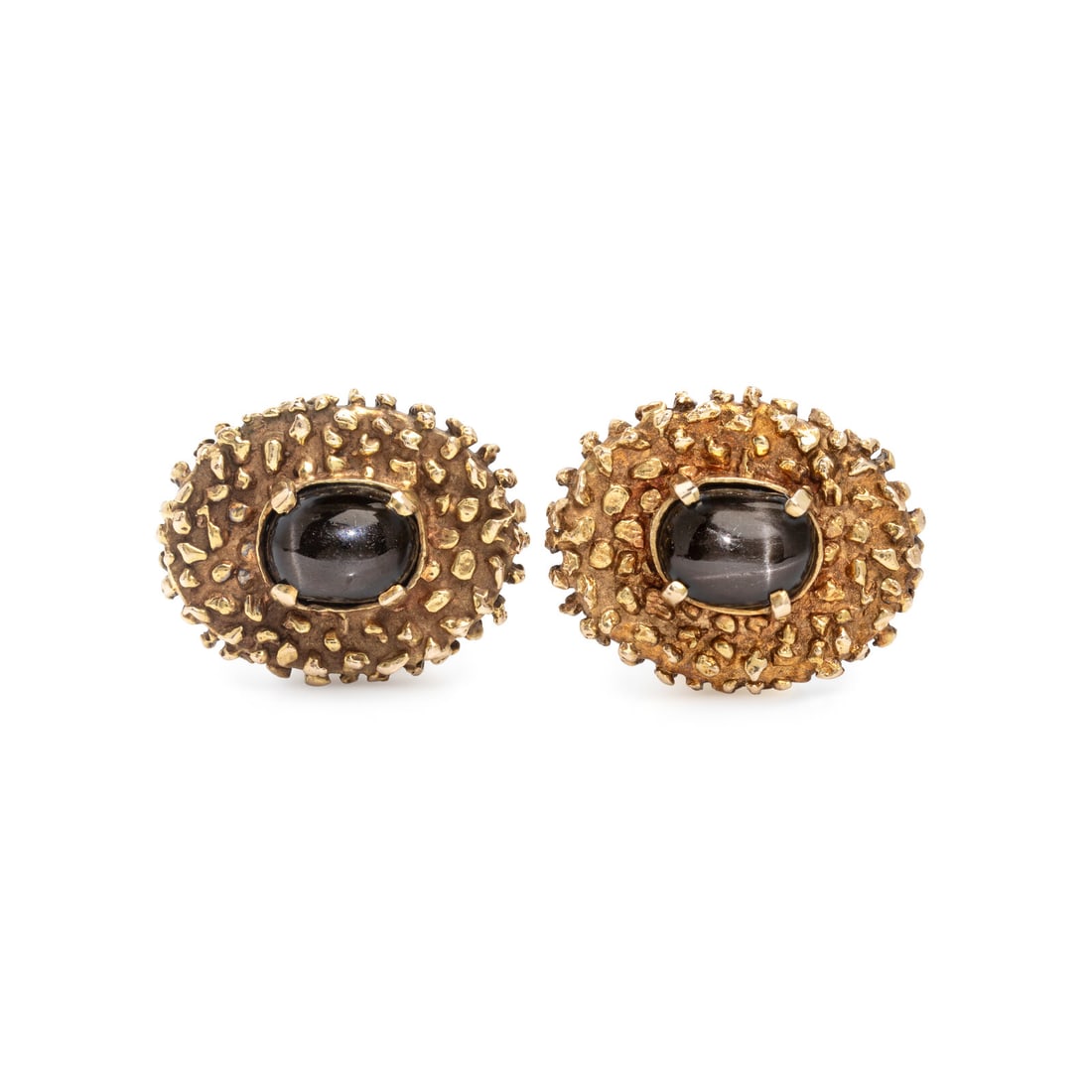 La Triomphe, Star Diopside and Yellow Gold Cufflinks: La Triomphe, Star Diopside and Yellow Gold Cufflinks Oval cabochon star diopside measuring approximately 8.85 x 6.90 mm. 14 karat yellow gold. 7/8 inch wide. Stamp: LA TRIOMPHE 14K. Gross weight: 10.8