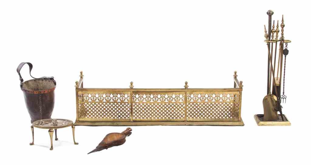 An Assembled Collection of Fireplace Articles, Width of: An Assembled Collection of Fireplace Articles, comprising a fire fender, an associated set of fireplace tools on stand, two bellows, a brass footman and a fire bucket; 11 items total. Width of first 4