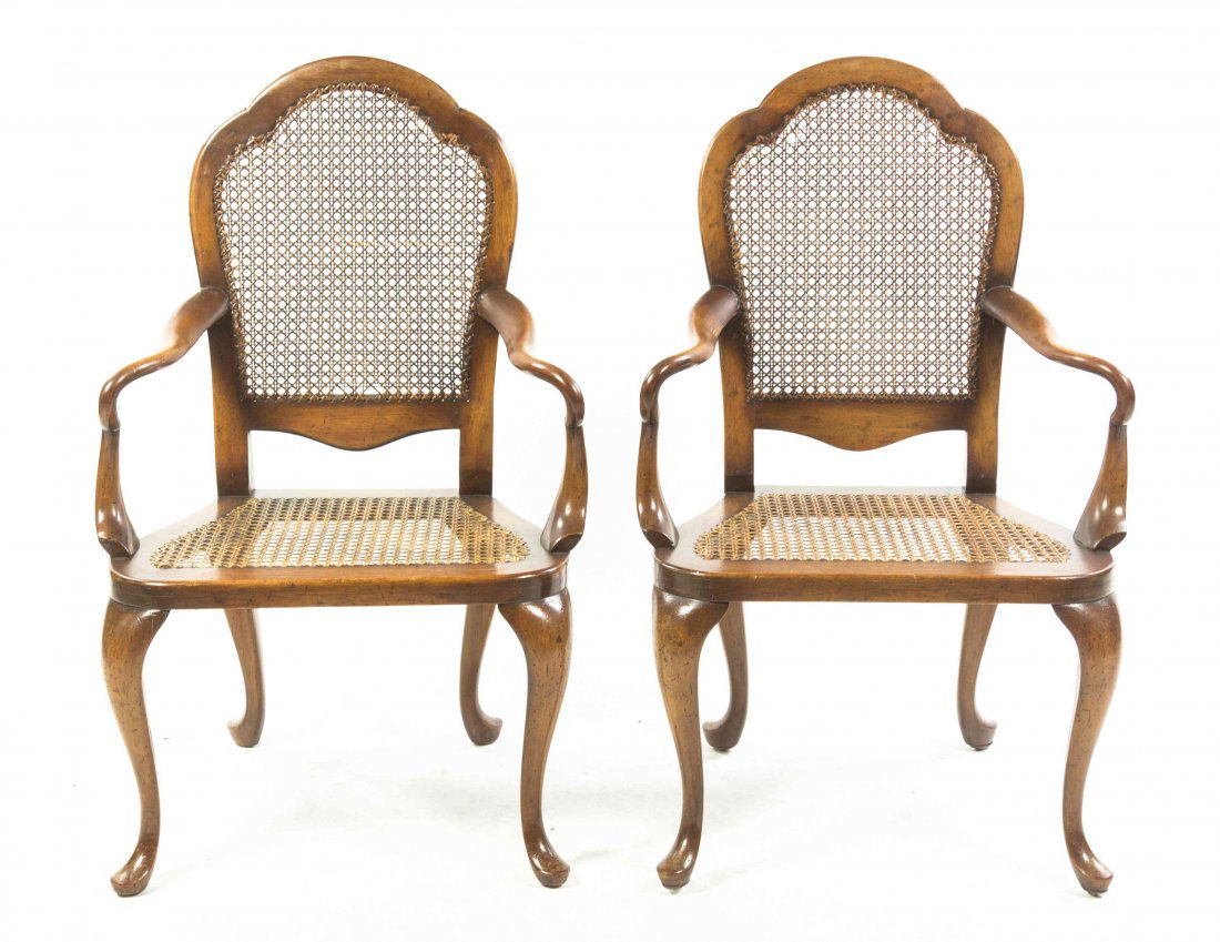 A Pair of English Mahogany Open Armchairs, Height 38: A Pair of English Mahogany Open Armchairs, each having a caned back and seat, raised on cabriole legs. Height 38 1/2 inches. Property from the Estate of Peggy G. Richards, Barrington, Illinois
