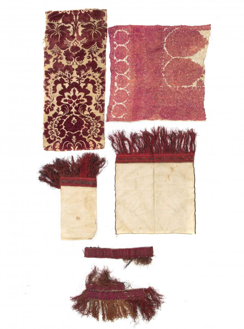A Collection of Six Textile Fragments, Length of: A Collection of Six Textile Fragments, comprising two table runner ends, three sections of border and an embroidered silk panel. Length of longest 3 feet 8 inches. Property from the Estate of Benjamin