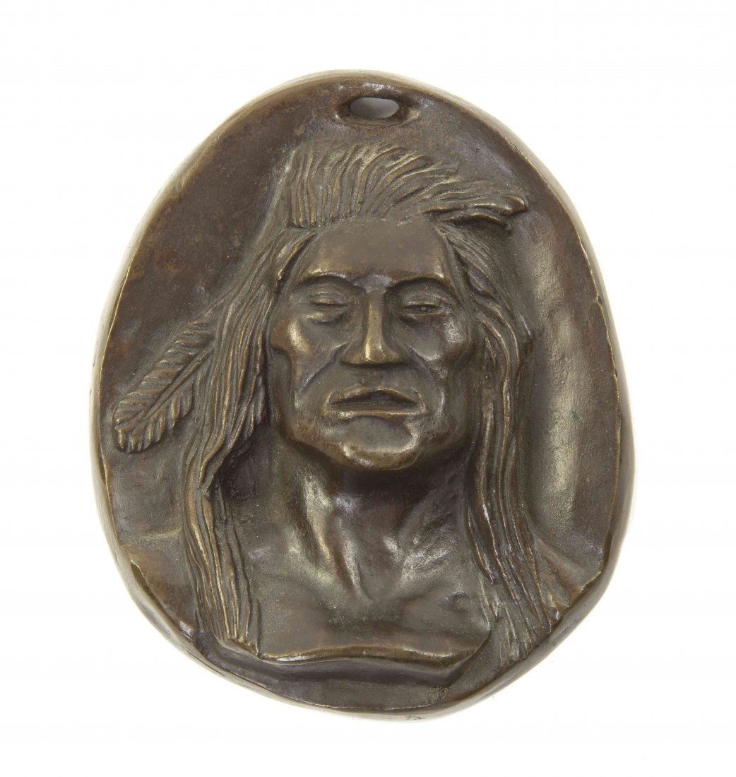 An American Bronze Medallion, Charles Russell, Height 4: An American Bronze Medallion, Charles Russell, of oval form, depicting a Native American, the verso incised C.M.R. Height 4 1/2 inches.