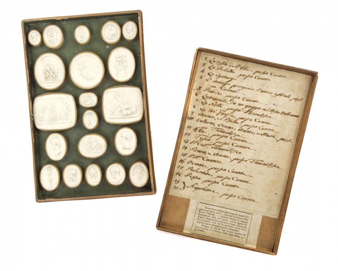 A Grand Tour Cased Set of Twenty Plaster Intaglios,: A Grand Tour Cased Set of Twenty Plaster Intaglios, depicting classical busts, profiles and various mythological scenes, the top of the case lined with paper giving the title of each. Width of widest