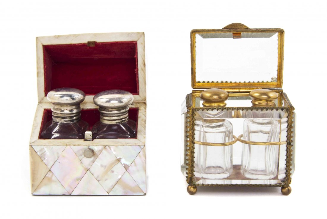 Two Diminutive Perfume Caskets, Width 2 3/4 inches: Two Diminutive Perfume Caskets, comprising a beveled glass example and a mother-of-pearl veneered example, each containing two glass bottles. Width 2 3/4 inches (each). Property from the Collection of