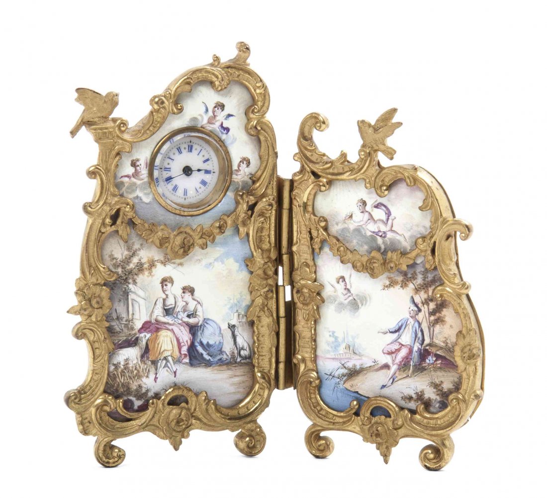 An Austrian Gilt Bronze Mounted Enamel Desk Clock,: An Austrian Gilt Bronze Mounted Enamel Desk Clock, in the form of a two-panel screen, decorated with figures in a landscape, set with a pocket watch movement, having a circular enameled dial with Roma